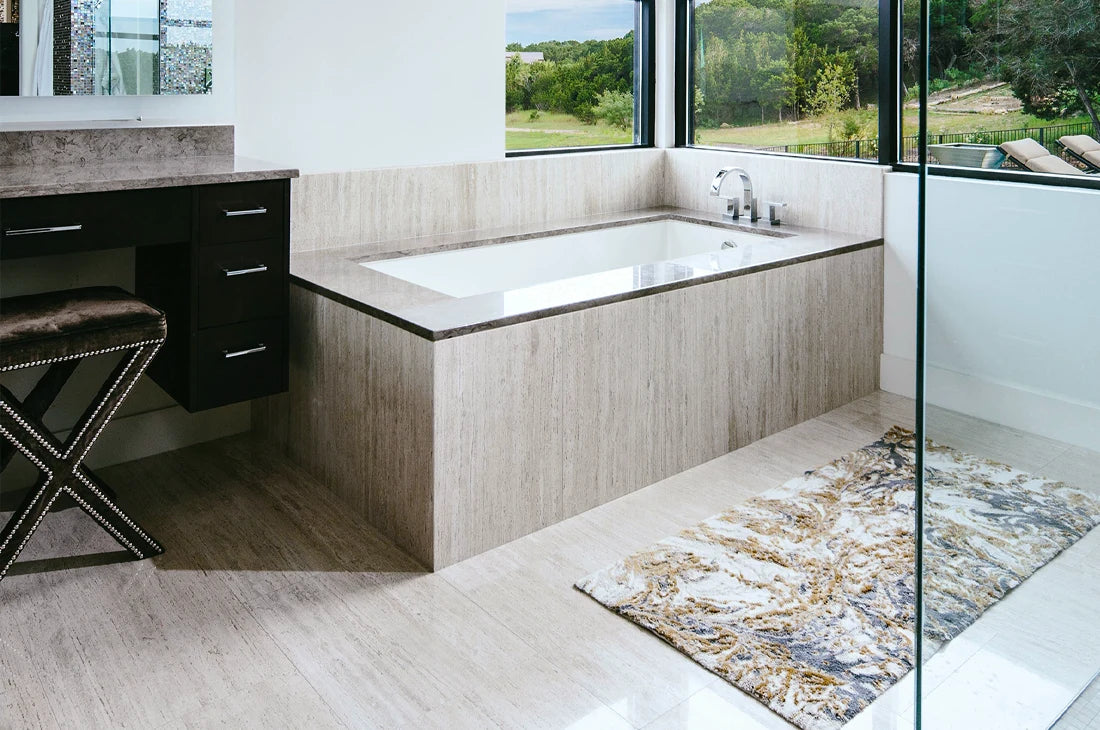 Bathtub surround and floor in Vintage Vein Cut Travertine tile
